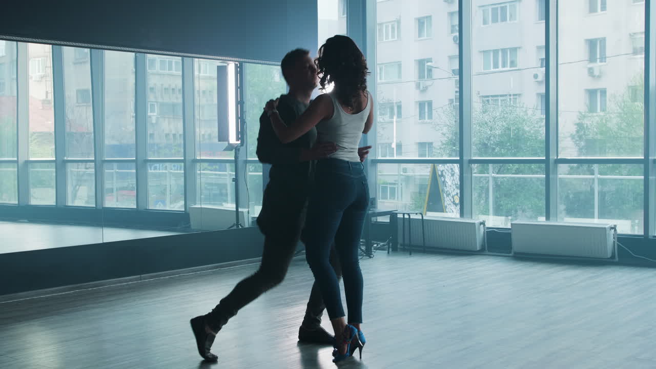 Couple dancing in studio