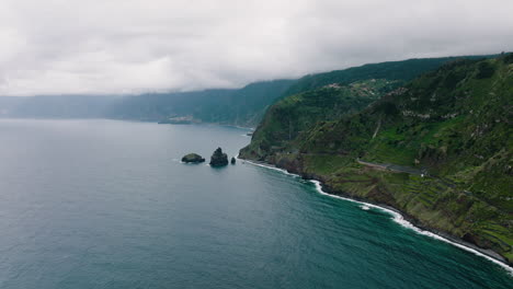 aerial along porto moniz steep and rugged rocky coastline, madeira, portugal