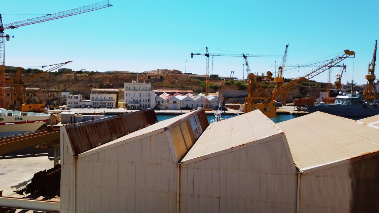 Timelapse video from Malta, Cospicua, docked ship maintenance with the view of industrial area. 2019.06.04