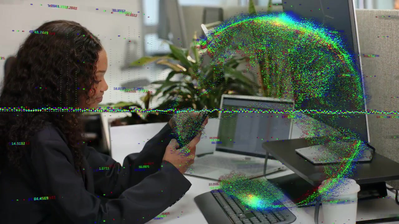 Woman at desk tapping phone glitch entering right arching over monitor then fading disrupting tech