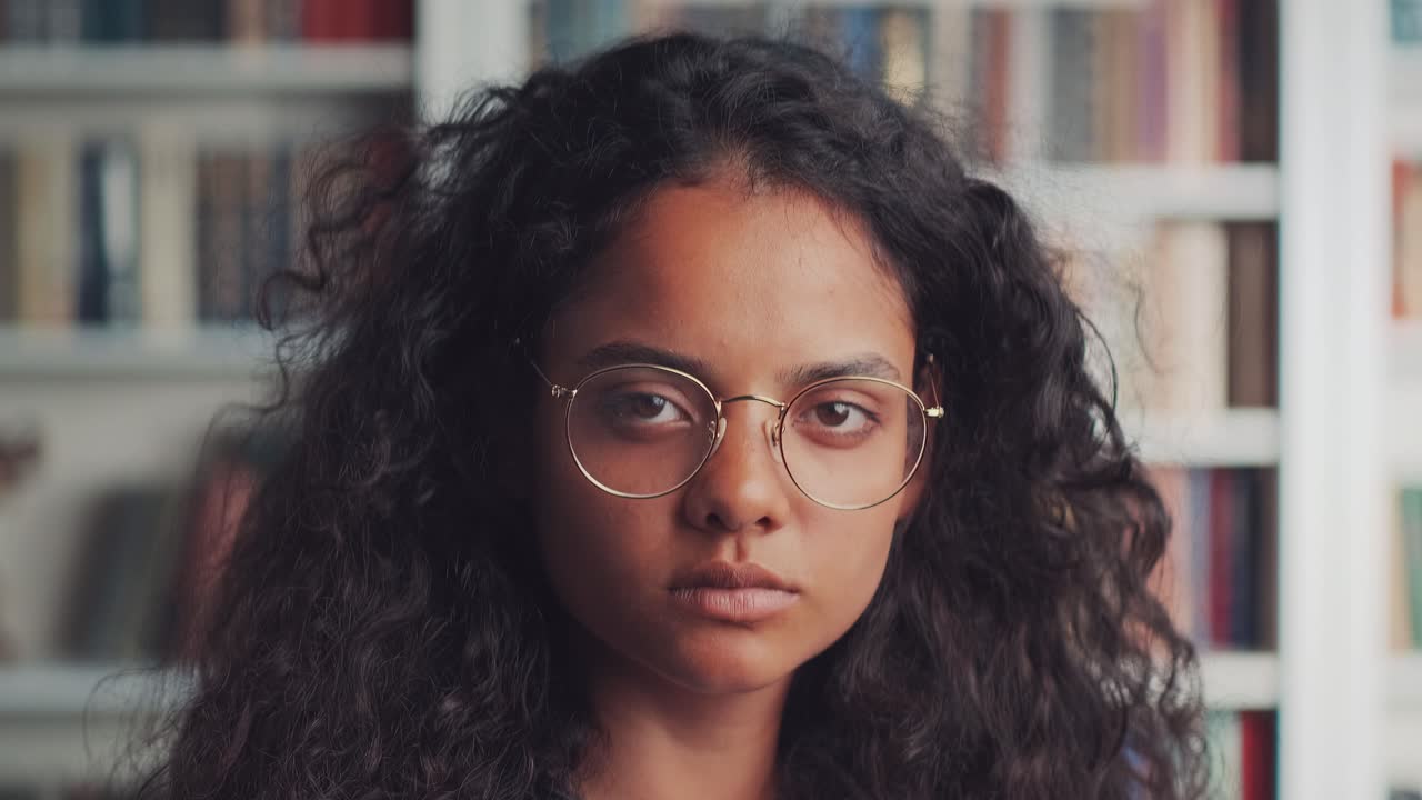 Close up portrait of beautiful serious confident young indian ethnic woman