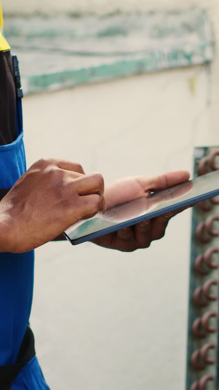Vertical video Technician inspecting freon levels