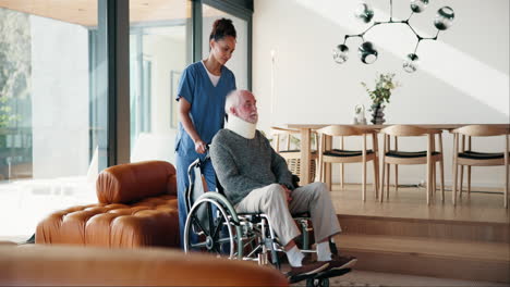 caregiver assisting senior man in wheelchair at home