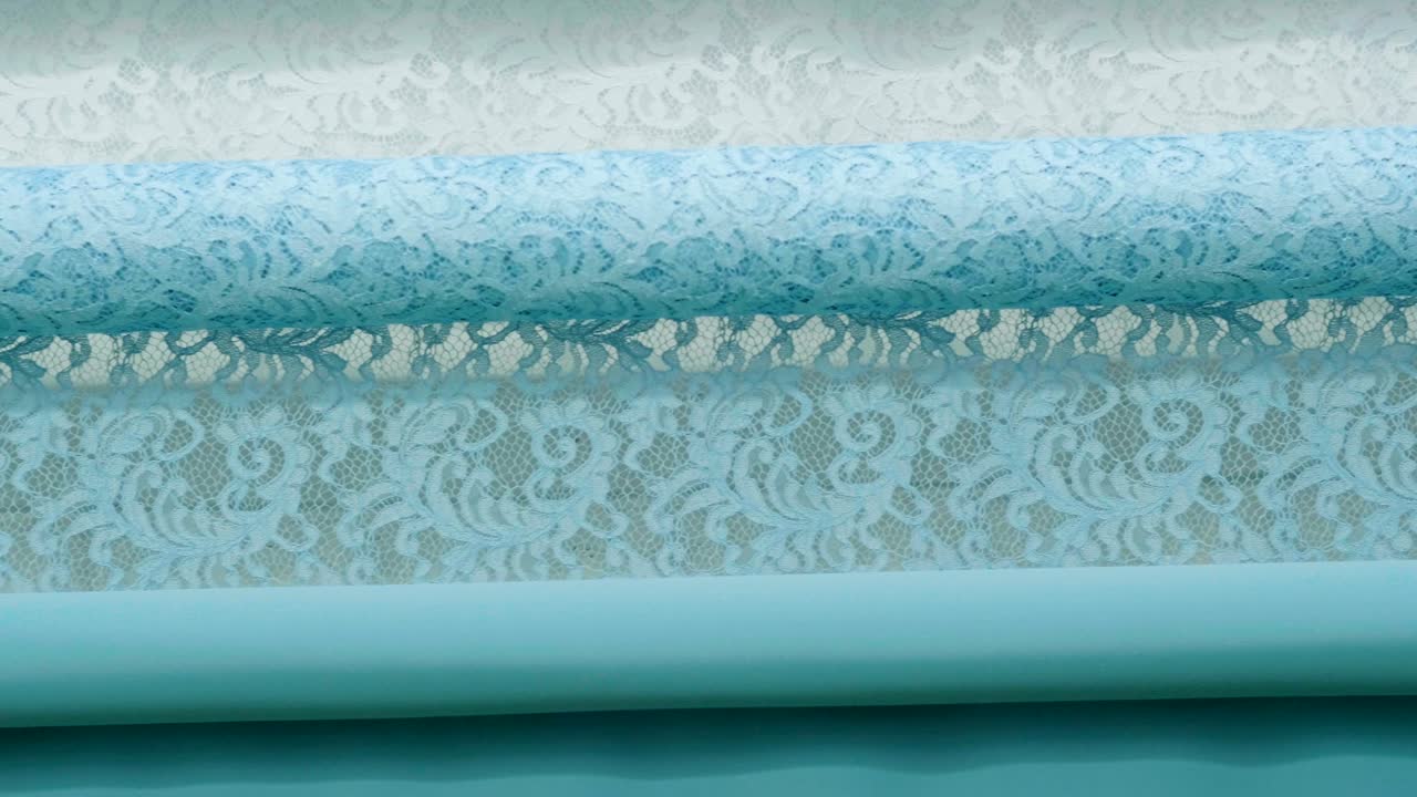 una foto macro de un encaje, tela utilizada para hacer elegantes vestidos de novia para el día de la boda.