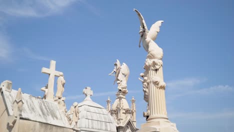 cemetery statues and sculptures under a clear sky