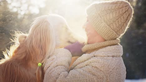 girl and dog in the snow