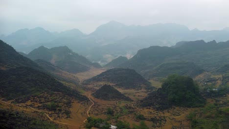 Cinematic-aerial-footage-of-mist-covered-beautiful-mountain-landscape-in-Vietnam