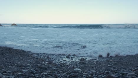 continuous waves hitting the rocky beaches of serra de dentro captured in 4k footage