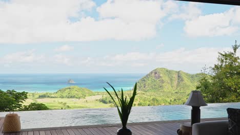 cinematic pan around infinity pool with outlook over ocean from private villa