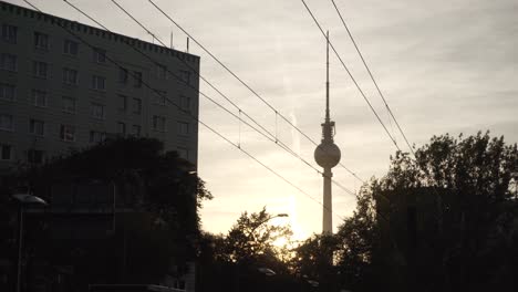 silhouette of famous tv tower in berlin city during a beautiful sunset