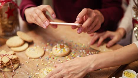 Handheld-view-of-man-photographing-Christmas-cookies-in-the-kitchen