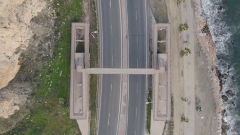 Breathtaking-aerial-view-of-parallel-roads-offering-coastal-drive