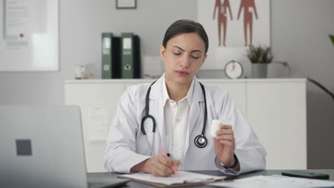 Indian-female-doctor-giving-medicine-to-patient