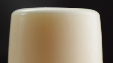closeup of beer head on a glass