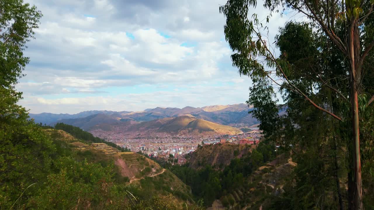 Tourist walking in Rumiwasi historic place overlooking Cusco city, Peru