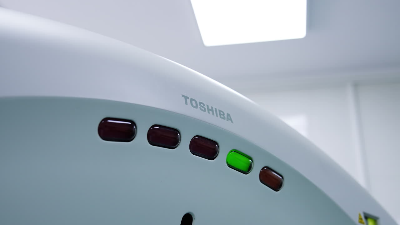Top part on the magnetic resonance machine Toshiba. Five long lamps on the equipment for tomography.