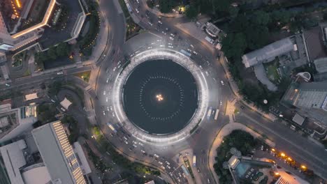 tracking cars in a city traffic circle - 3d render animation loop - birdseye drone shot