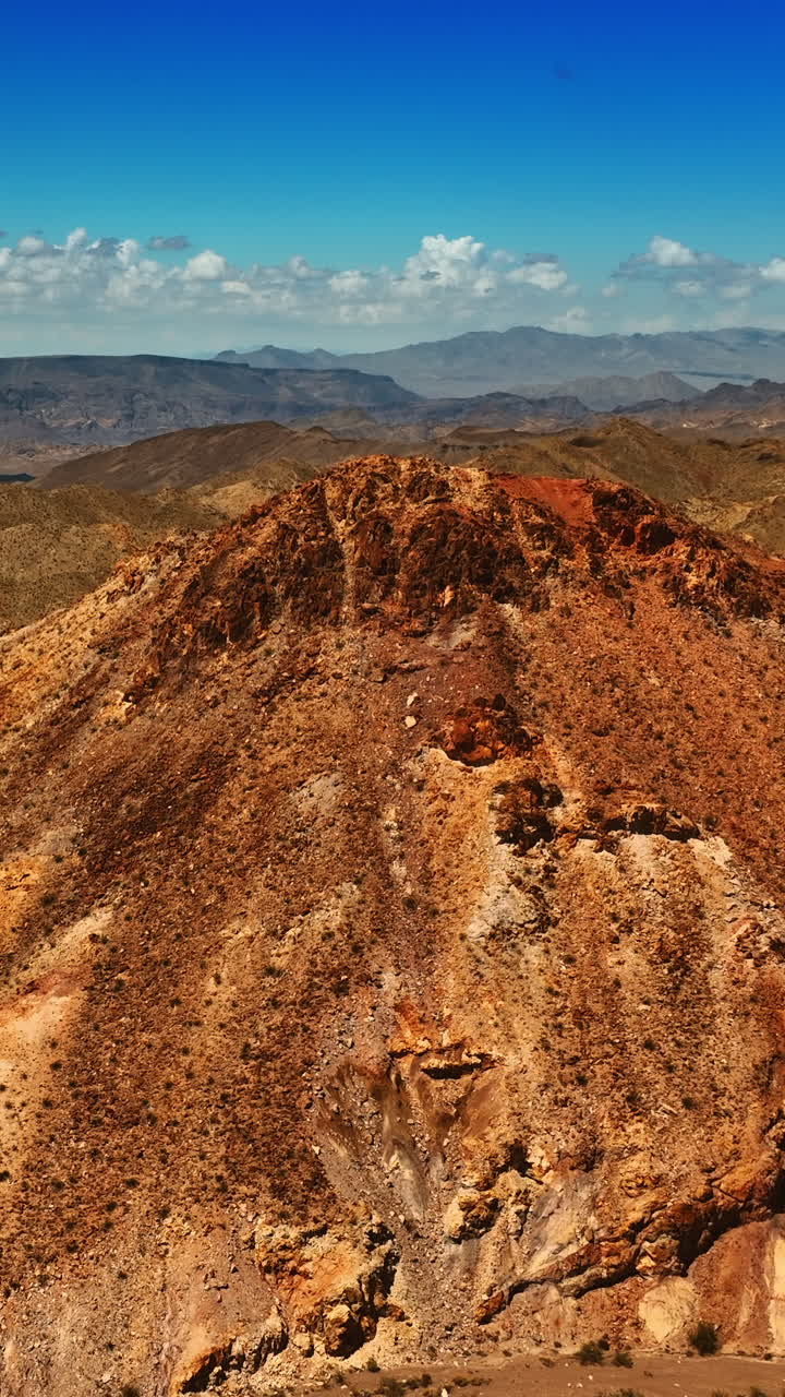 Breath-taking scenery of the bare mountains. Rocks of Mojave desert from aerial perspective. Vertical video
