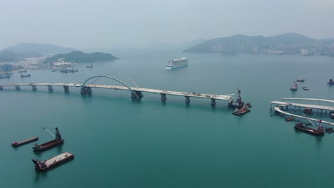 Hong-Kong-cross-bay-link-construction-project,-a-dual-two-lane-bridge-connecting-Tseung-Kwan-O-Lam-Tin-Tunnel-to-Wan-Po-Road,-Aerial-view