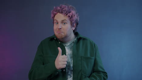 man with pink hair expressing surprise and joy