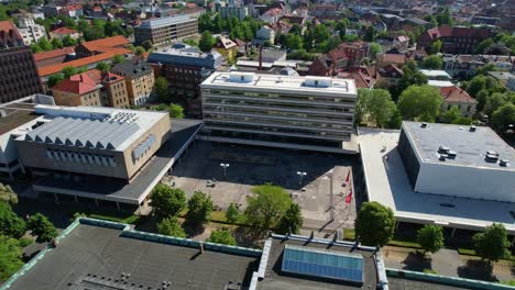 Rotating-droneshot-of-the-main-Campus-of-+TU-Braunschweig,-Germany,-on-a-sunny-day