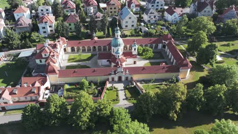 aerial view, church of our lady victorious in bílá hora neighborhood of prague, czech republic, drone shot