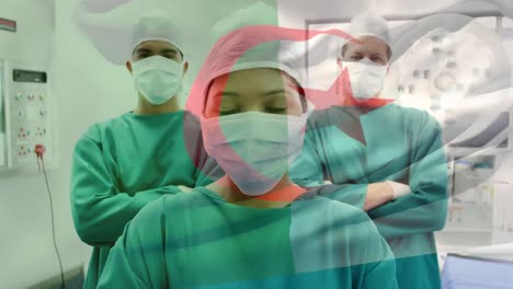 animación de la bandera de argelia sobre diversos médicos con máscaras faciales
