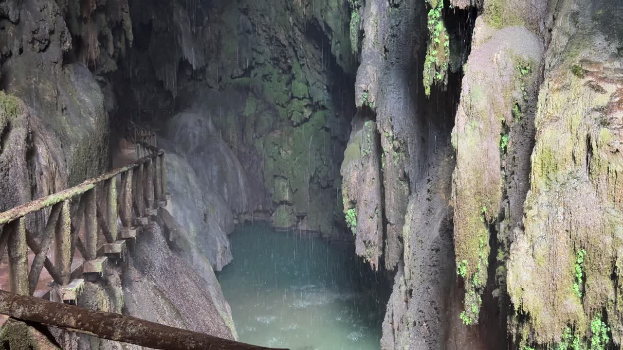 Water filtering through limestone in a natural cave. Tilt up