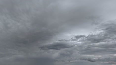 dark storm clouds swiftly moving across the sky in an atmospheric timelapse