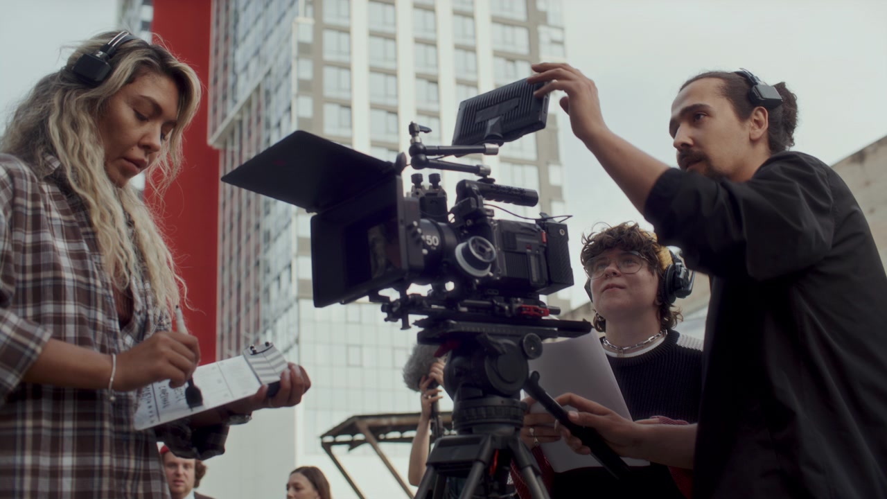 Movie Crew Preparing Camera for Shoot on Outdoor Film Set