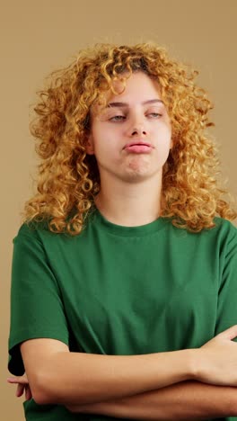 young woman with curly red hair displaying various emotions