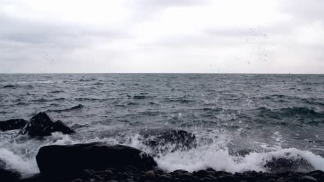 maine wave splash on rocks medium snow slow mo