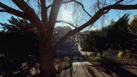 Cinematic-lifting-shot-of-the-surroundings-of-Sacre-Coeur-Monmartre-in-Paris,-France,-Europe