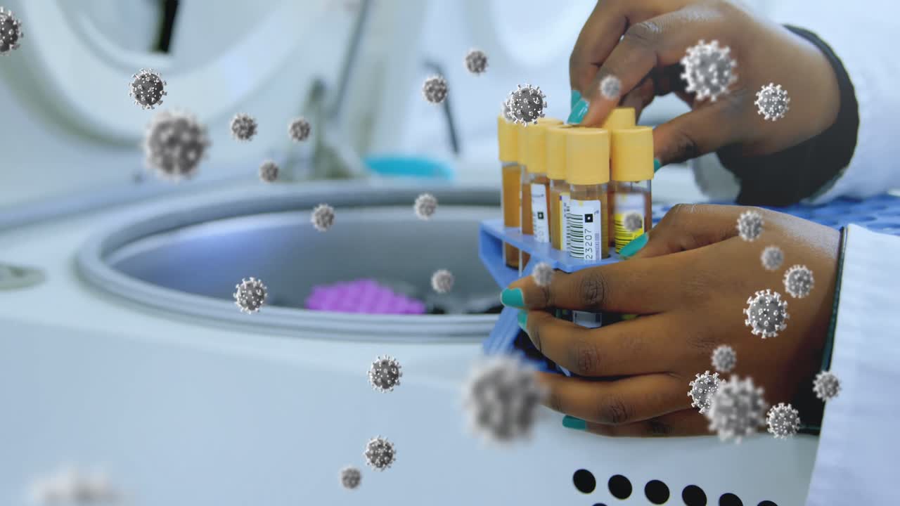 Animation of floating macro Covid-19 cells over mixed race doctor checking samples in lab