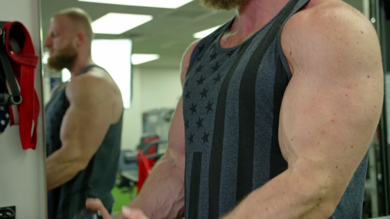 Strong bodybuilder strength workout in sport club