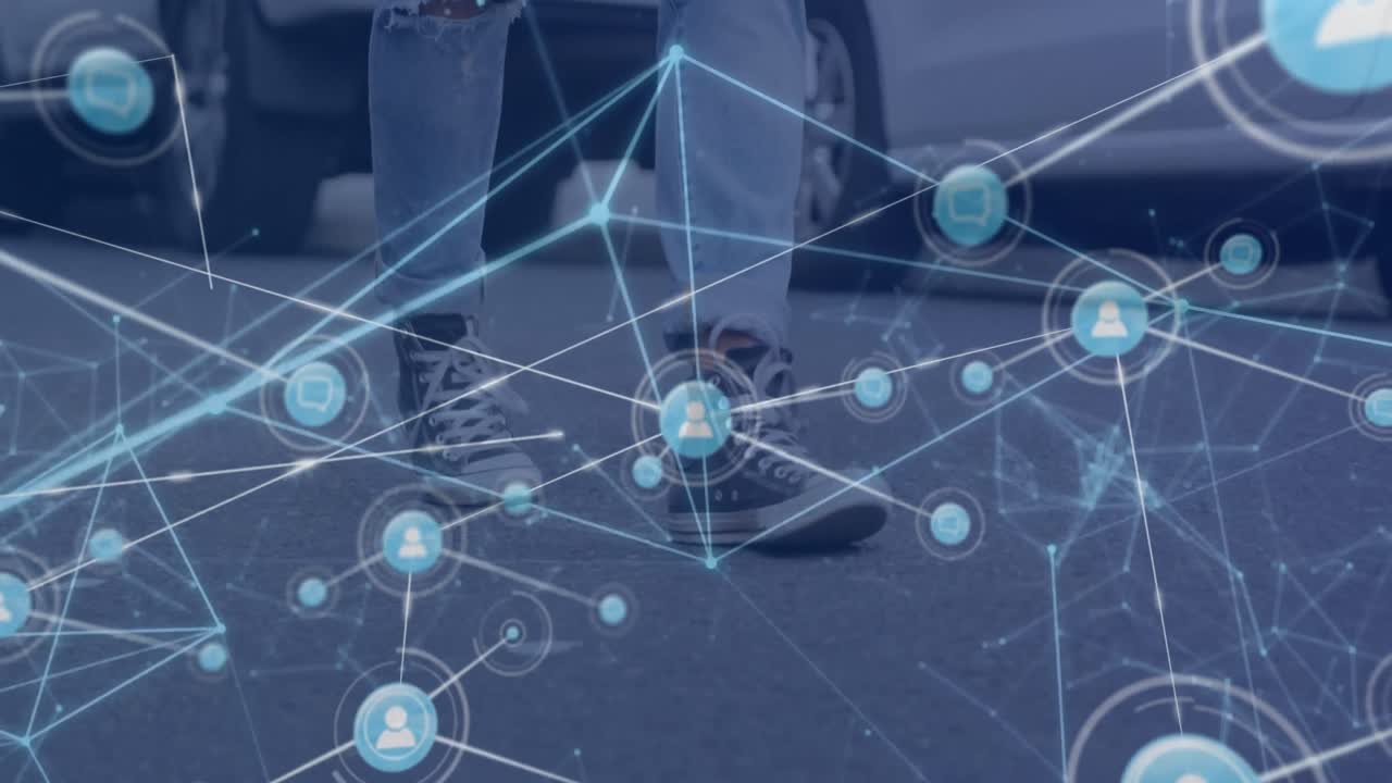Animation of network of digital icons against low section of man walking on the street