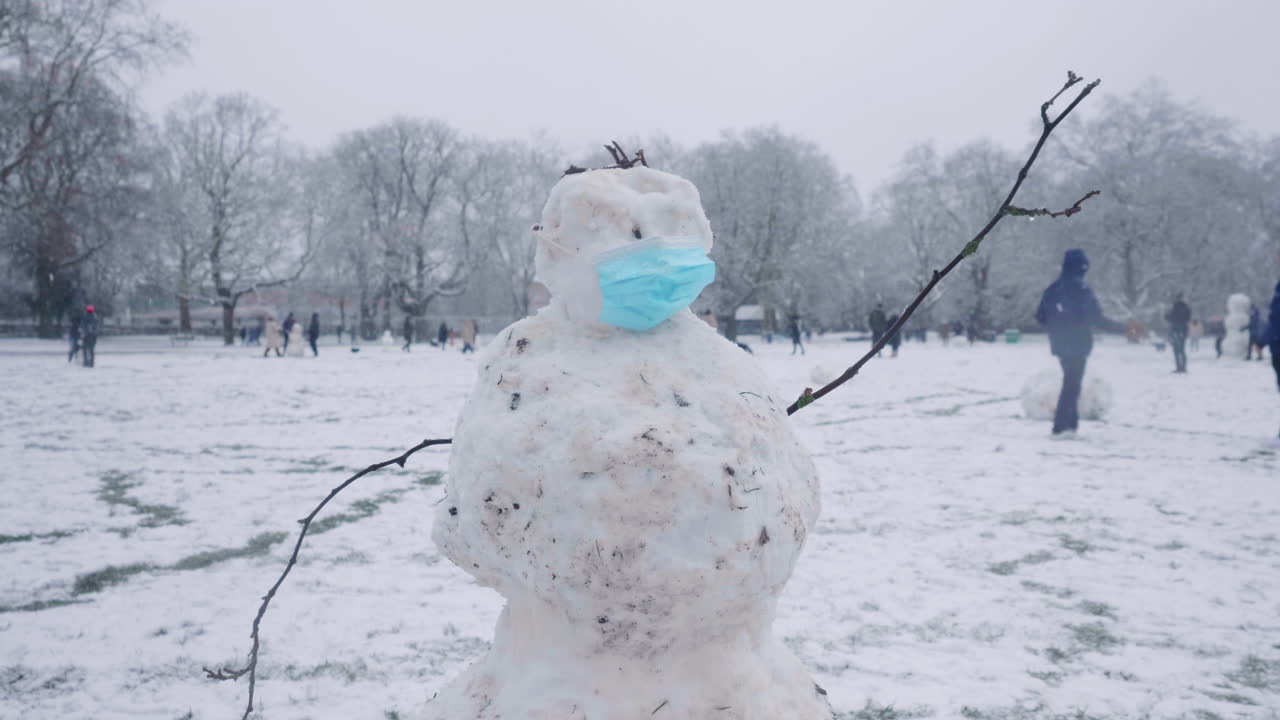 Mid shot of a snowman during the corona pandemic in London.