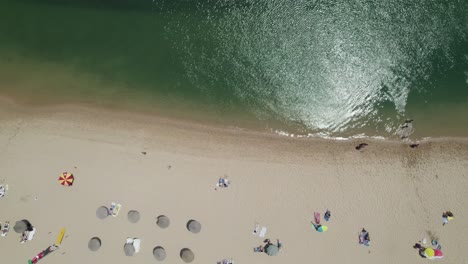 Vila-Nova-de-Milfontes-beach-Shore,-tourists-at-shoreline,-Alentejo