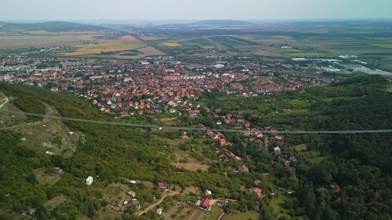 Panning aerial view along the Bridge of National Unity with Sátoraljaújhely landscape in Hungary