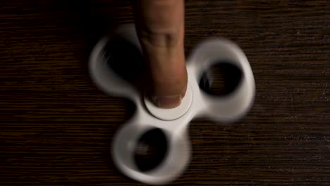 spinning fidget spinner on a wooden table