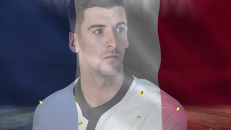 confeti dorado y francia ondeando una bandera contra un jugador de rugby caucásico que sostiene una pelota de rugby