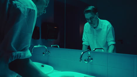 man in bathroom at night
