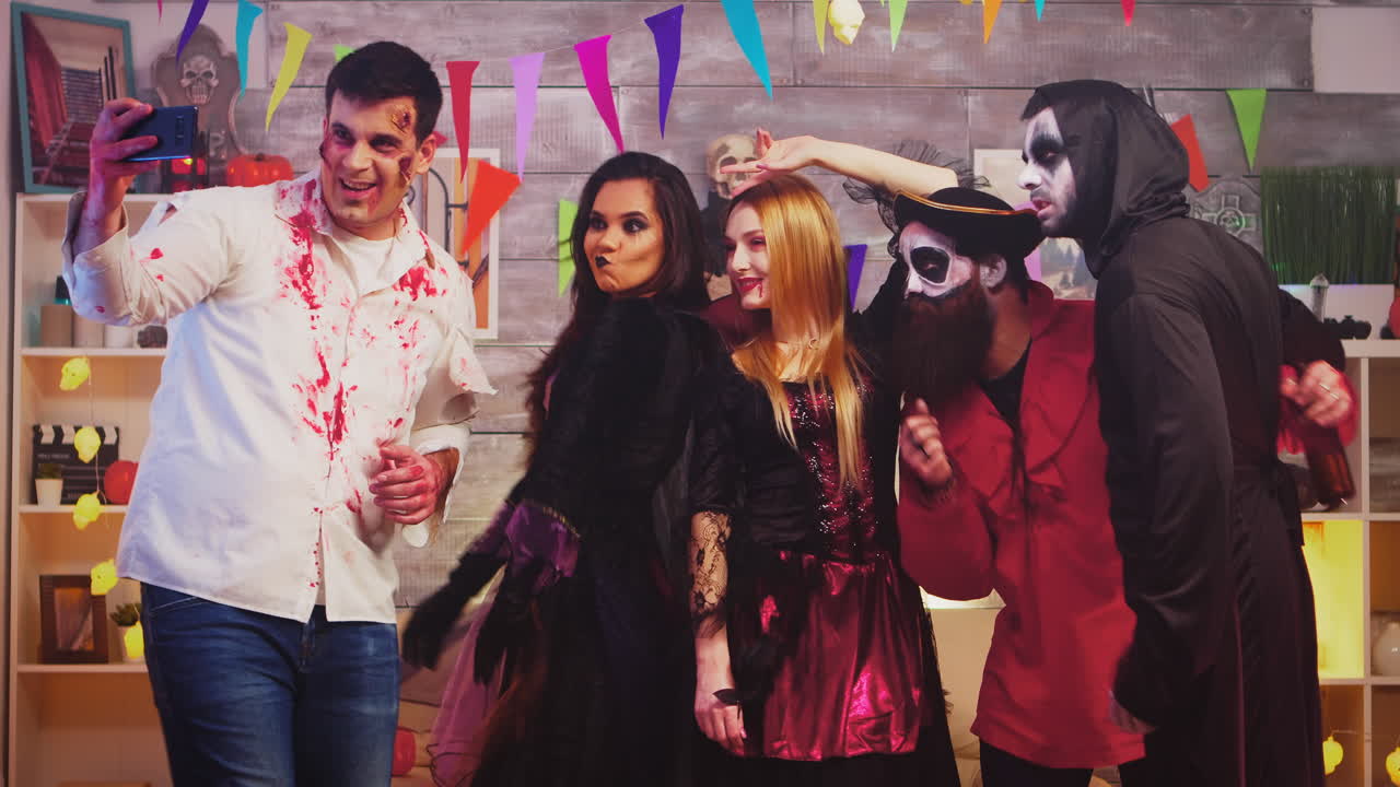 Group of friends in costumes taking a selfie
