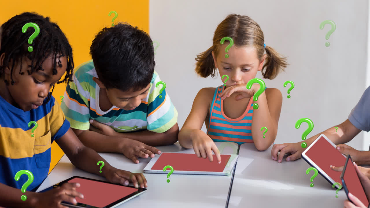 Animation of green question marks over diverse elementary school pupils using tablets in class