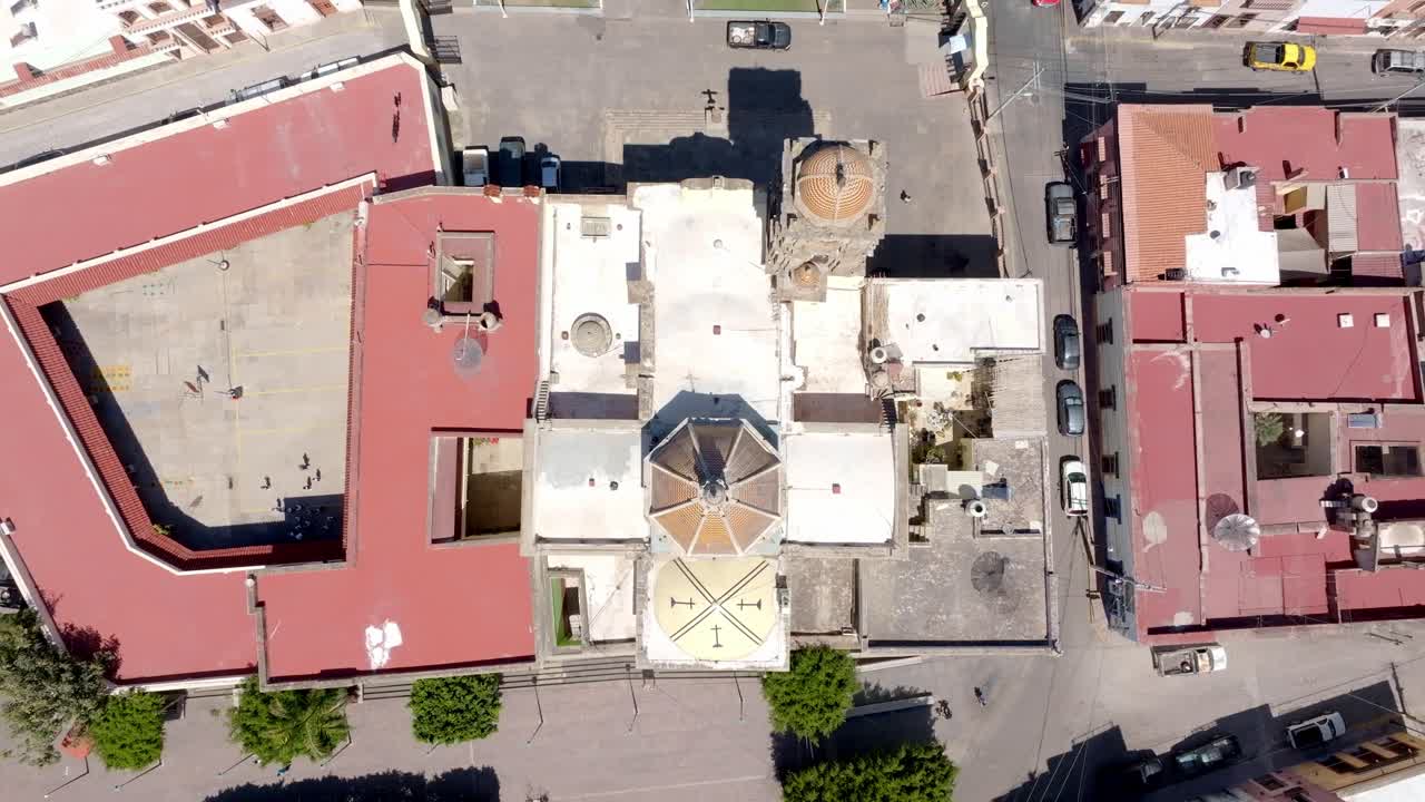 Overhead aerial view of The Inmaculada Concepcion Parish catholic church in Amatitan in hot sunny daylight, Jalisco
