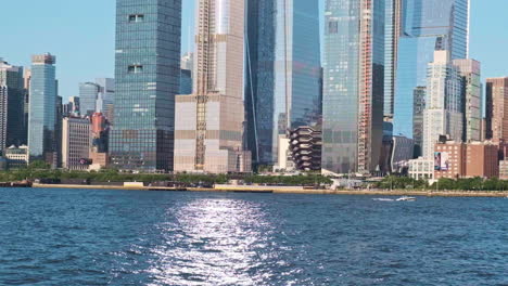 Zoomed-in-shot-from-Hudson-River-of-Hudson-Yards-area-with-skyscrapers,-NYC