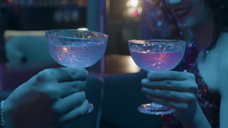 hands holding crystal glasses