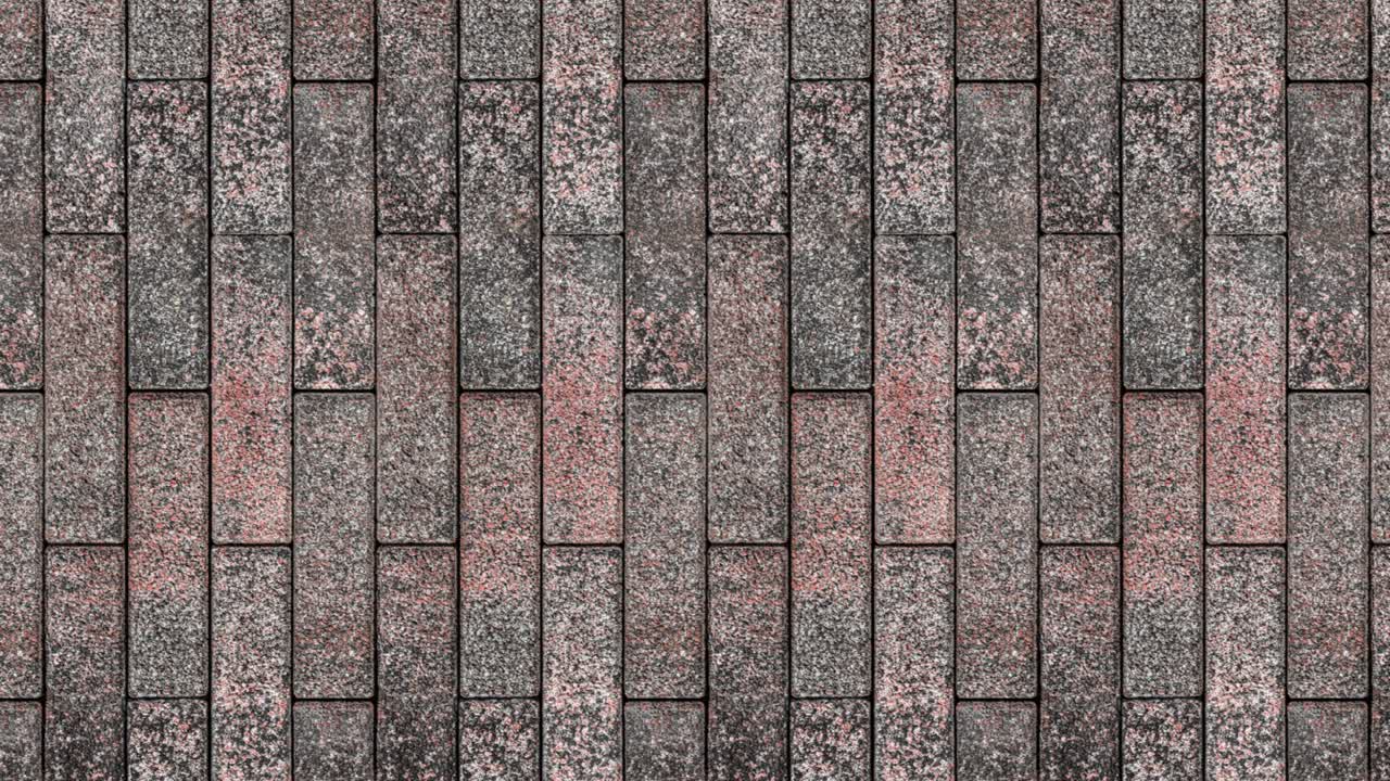 movimiento de bucle sin costuras. la pared está revestida con azulejos que imitan el granito de piedra natural. video orientado verticalmente.