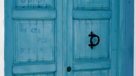 Blue-wooden-door-in-Altea,-Alicante,-Costa-Blanca,-Spain,-Mediterraneo