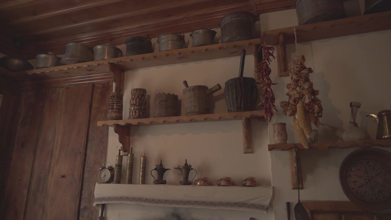 Rustic Kitchen Interior with Traditional Copper and Wooden Utensils